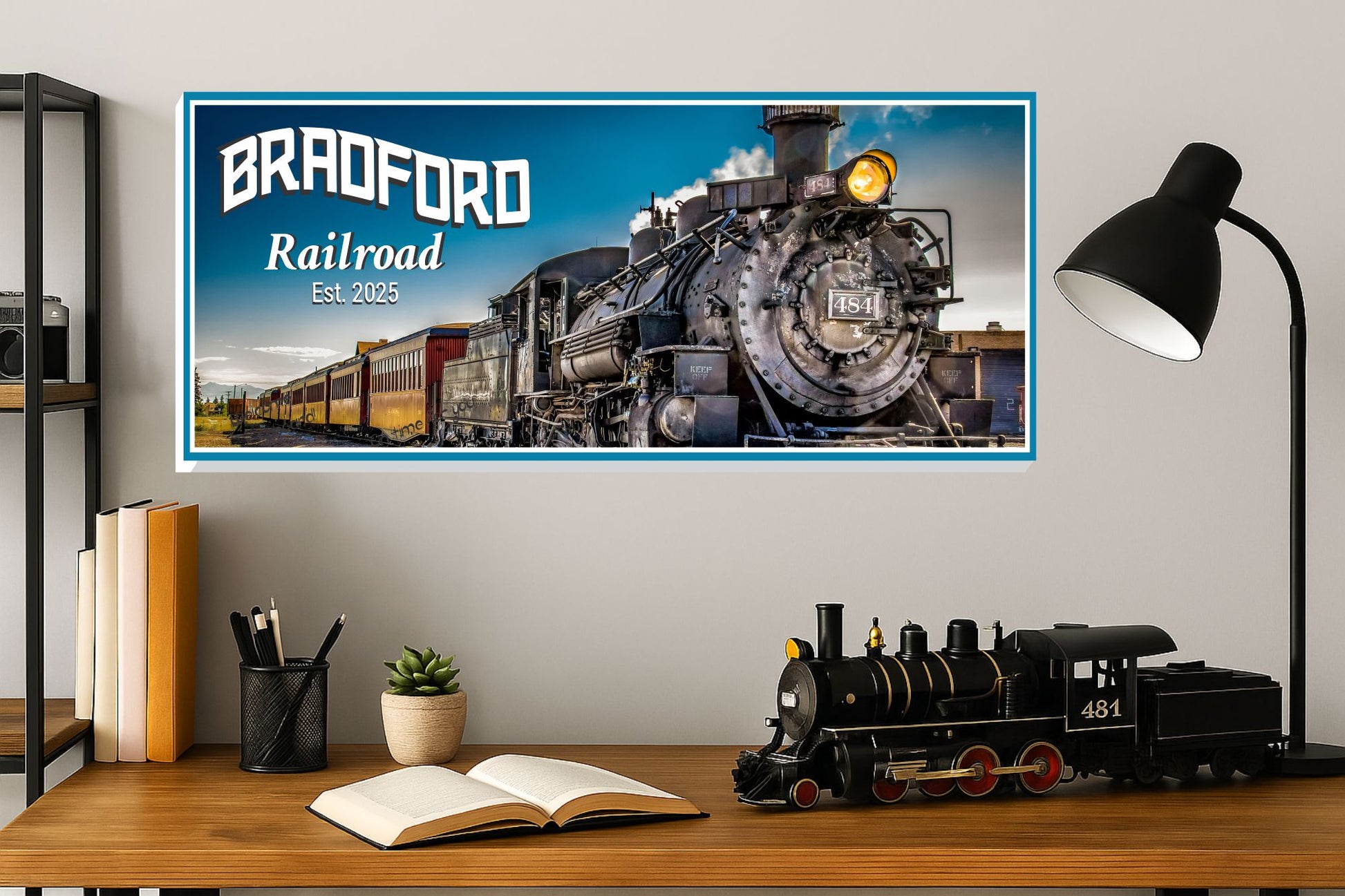personalized steam locomotive railroad sign displayed above desk with model train and books