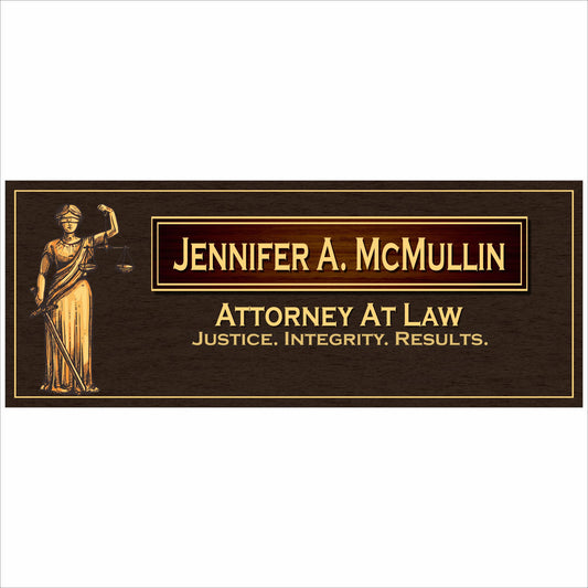 custom law office sign with lady justice and gold lettering on dark wood background close up