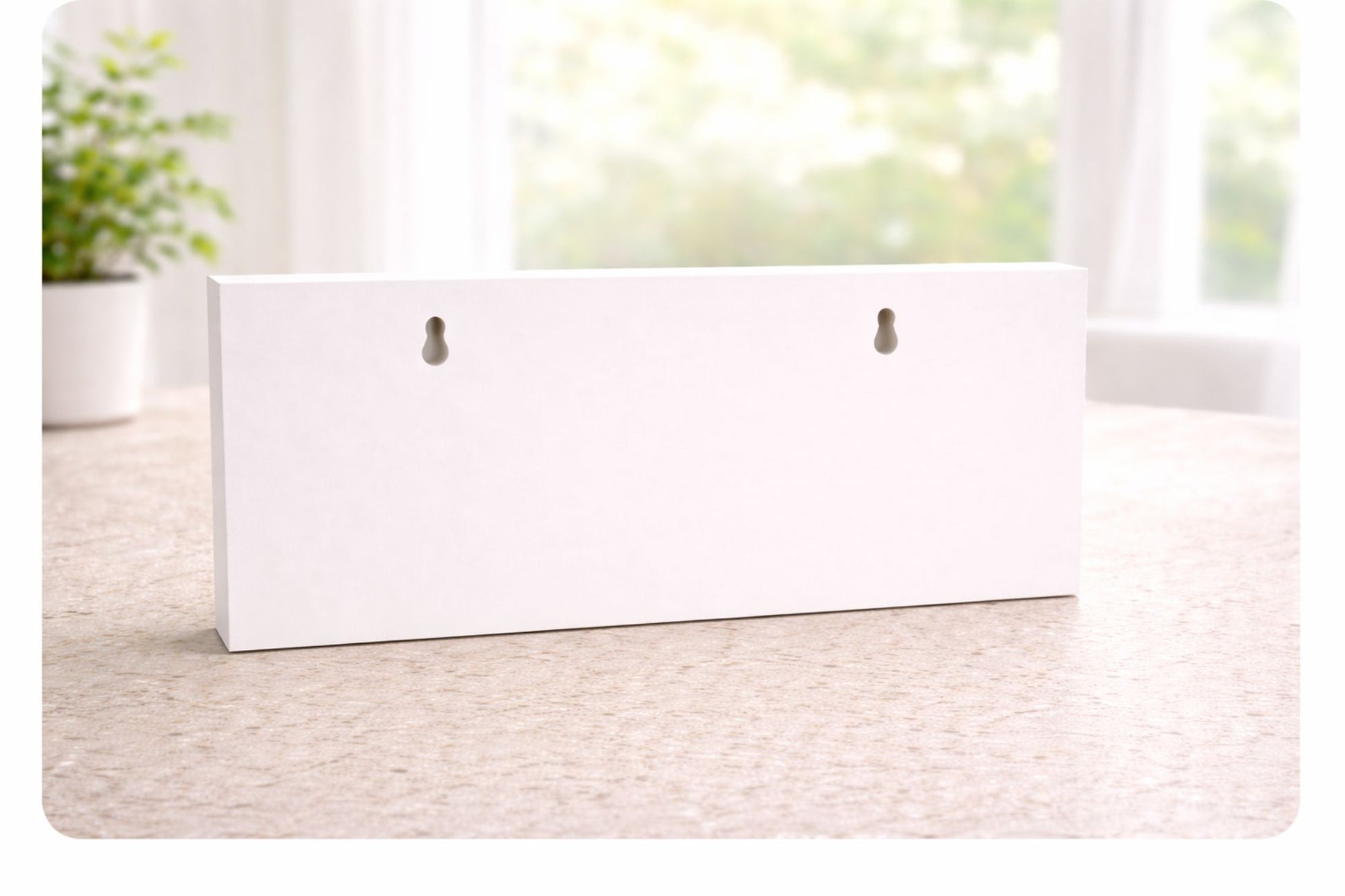 Back of rigid PVC sign showing keyhole slots for wall mounting