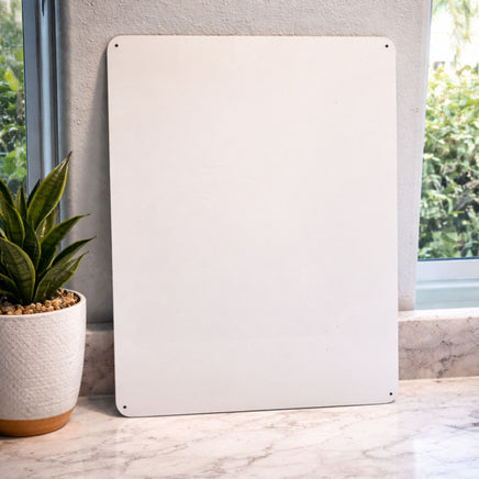 View of aluminum parking sign blank showing pre-drilled holes in the corners