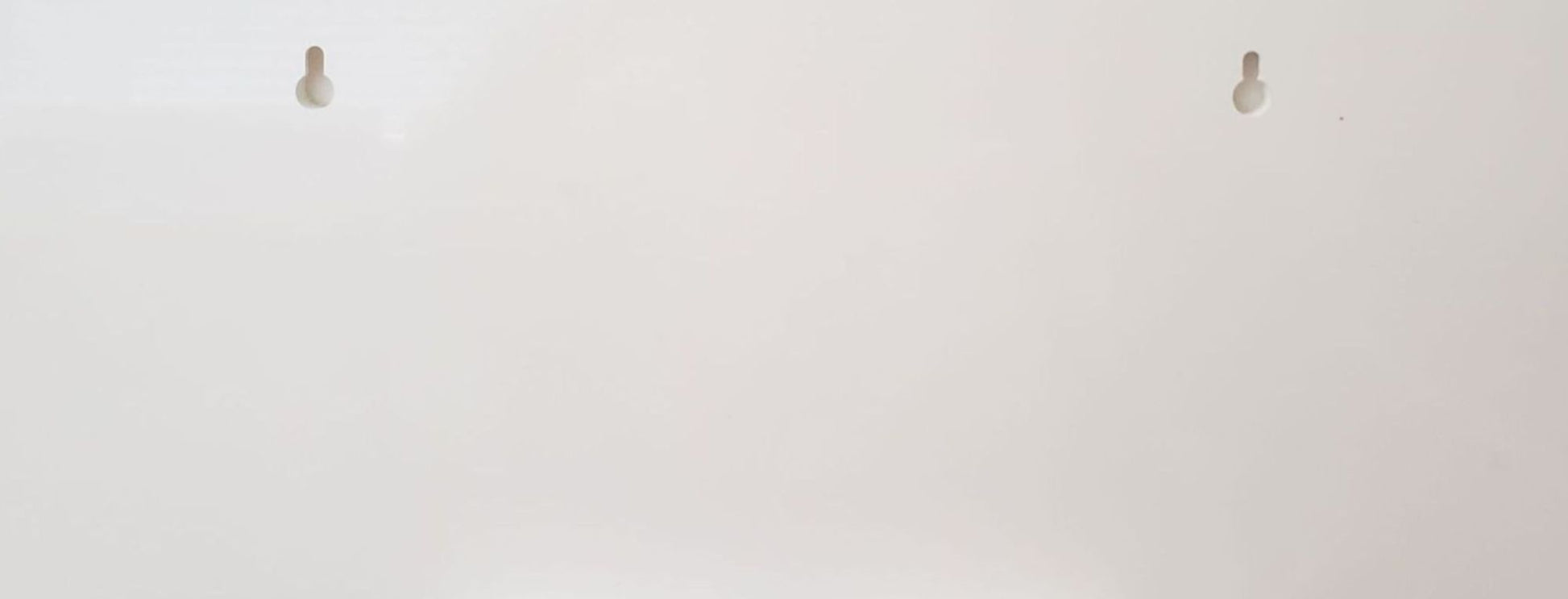 back of personalized horse name sign showing close-up view of keyhole slots for easy wall mounting