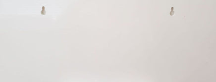 Back of PVC sign with routed keyhole slots for easy hanging on screws.