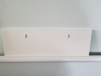 Back of Happy Easter wall sign showing keyhole mounting slots for easy hanging