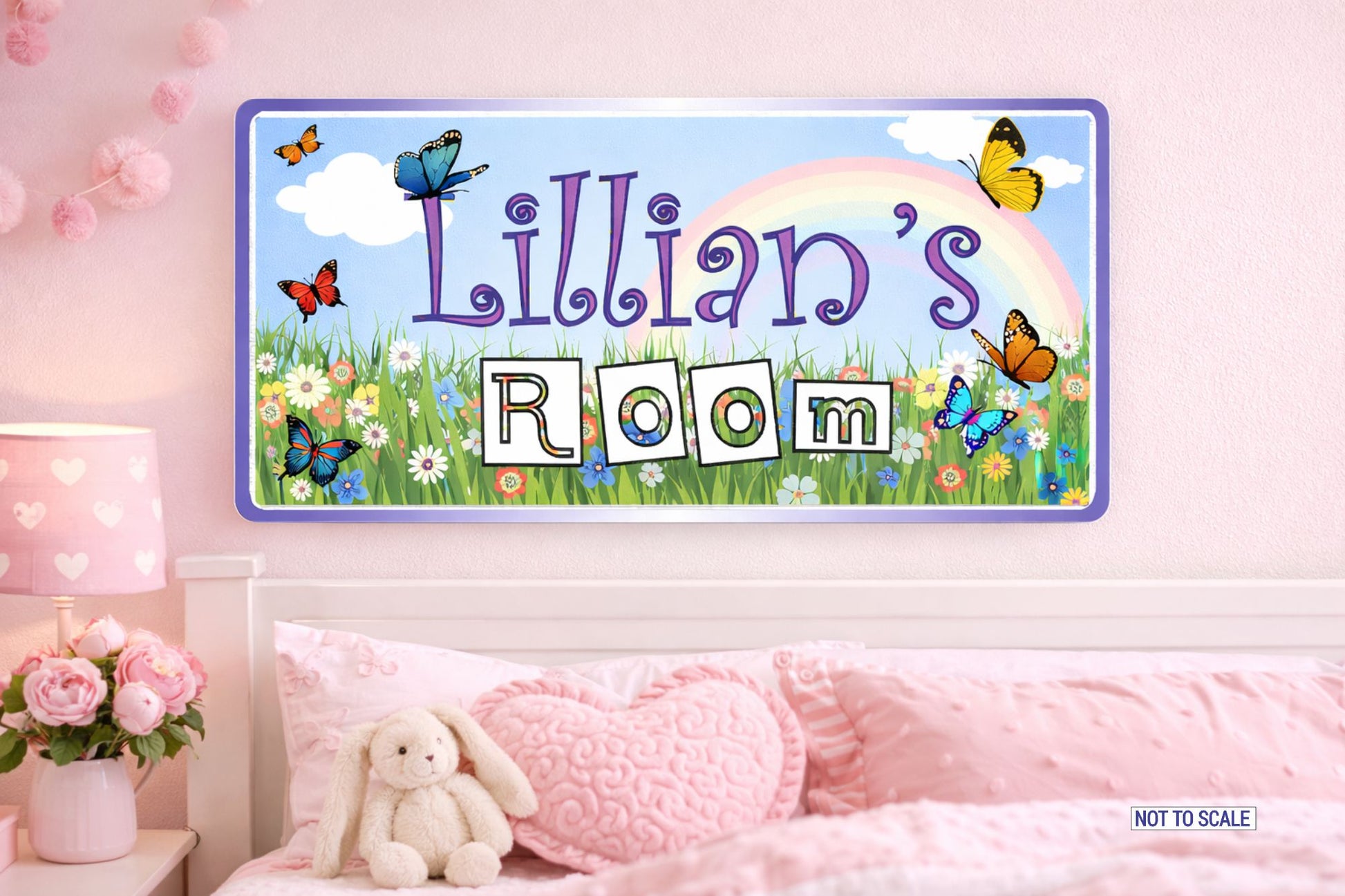 kids bedroom wall sign with rainbow meadow design above bed