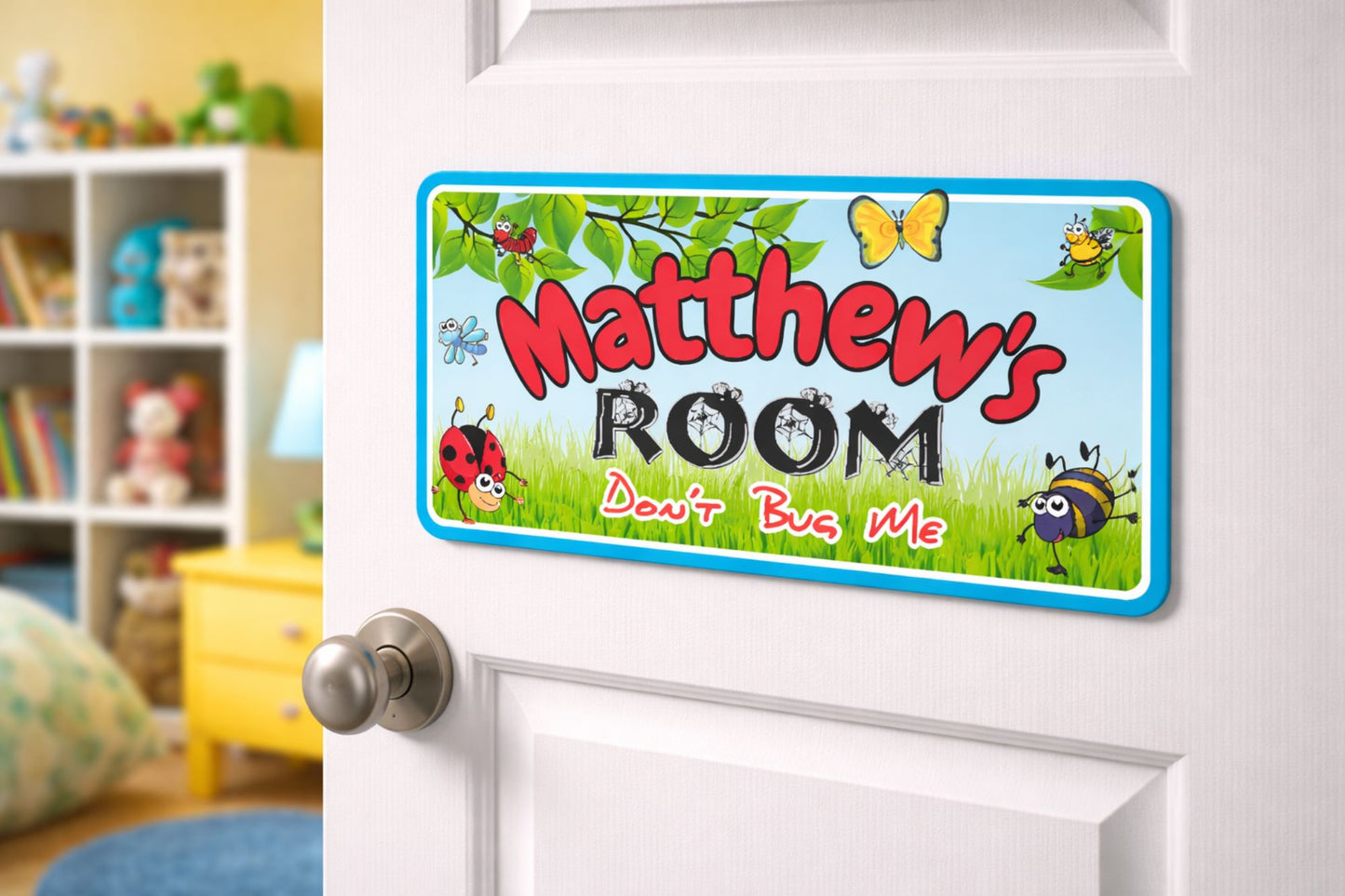 kids bug themed door sign mounted on bedroom door lifestyle image