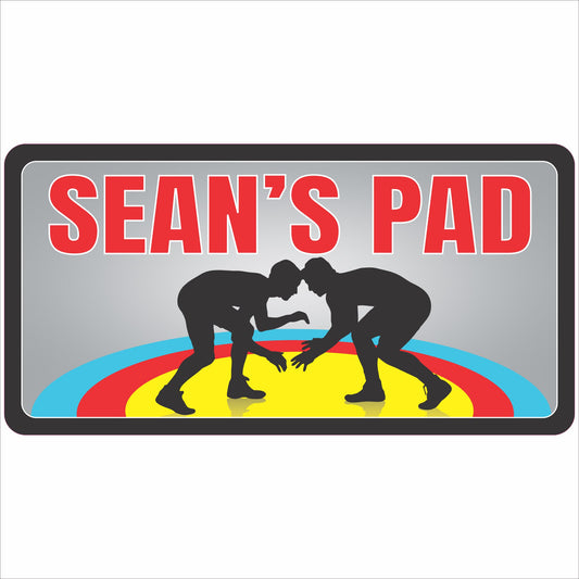 personalized wrestling kids room door sign with athlete silhouettes and colorful mat