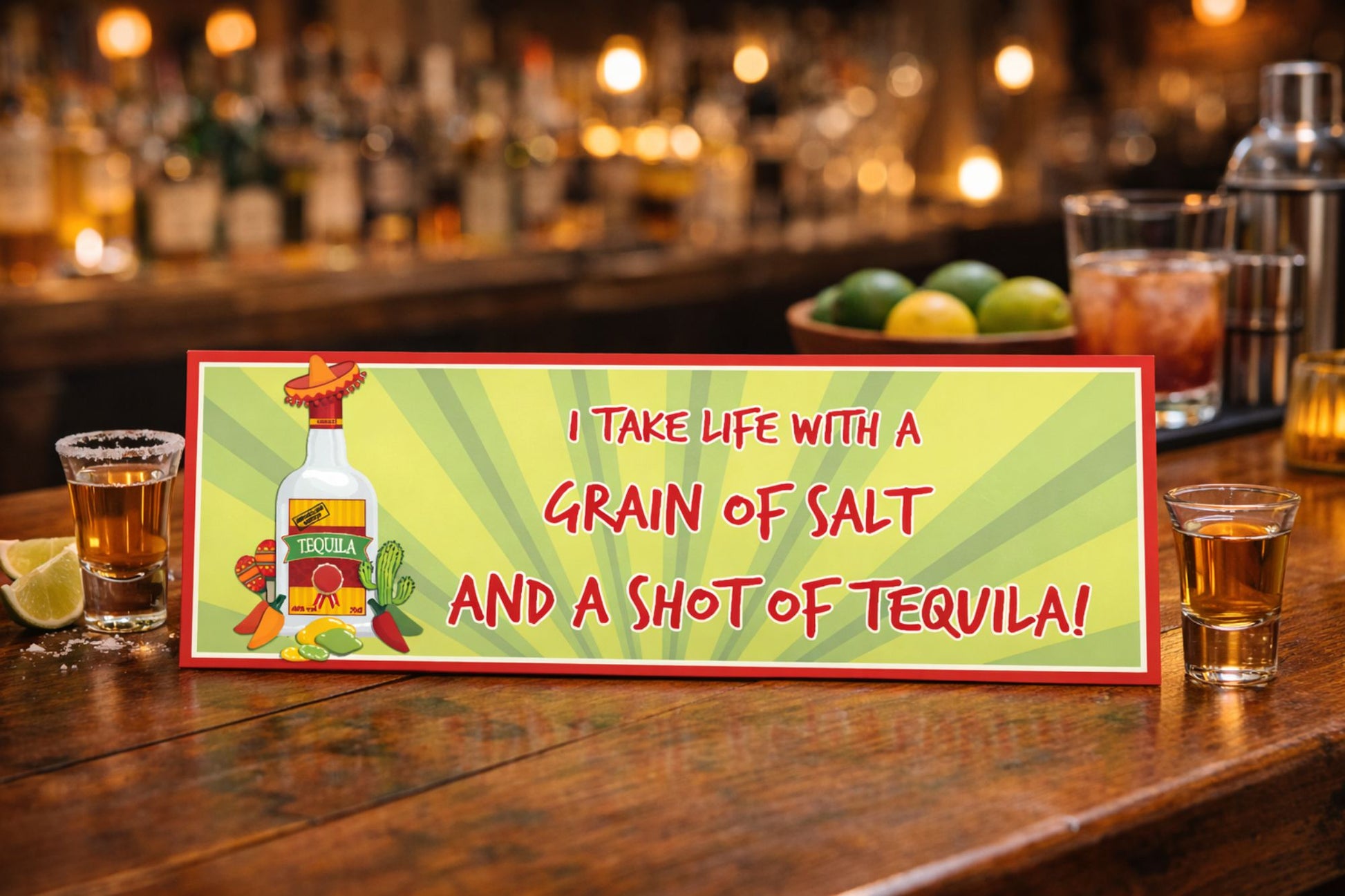funny tequila sign displayed on bar top with drinks and limes warm bar setting