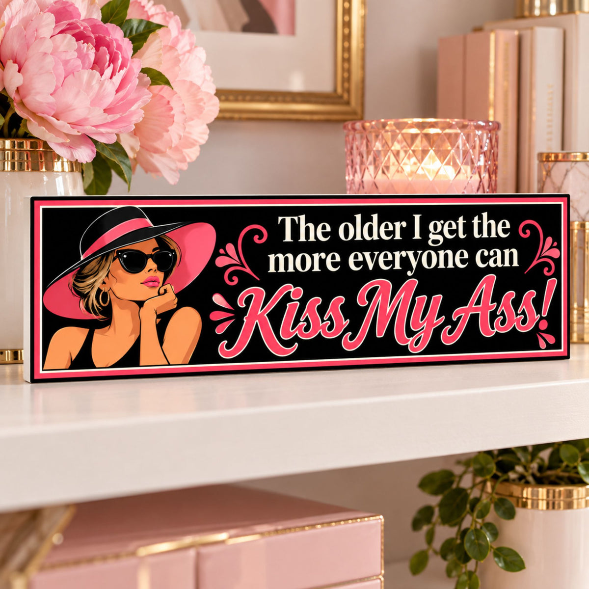 Funny 16x5 woman humor sign displayed on a feminine shelf with pink flowers and pink and gold decor.