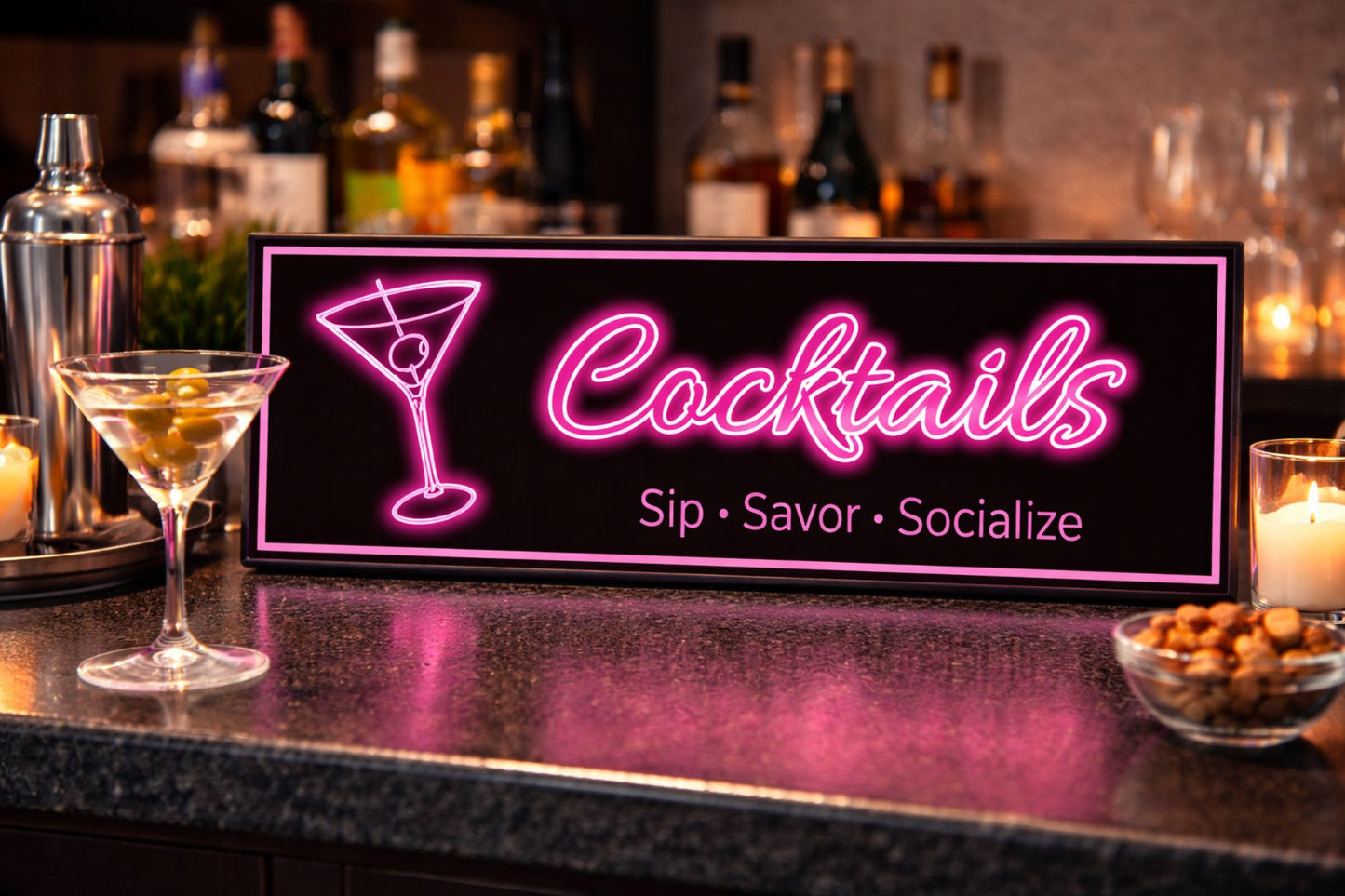 close up of neon style cocktail bar sign sitting on granite bar top with martini glass and liquor bottles in background warm ambient lighting