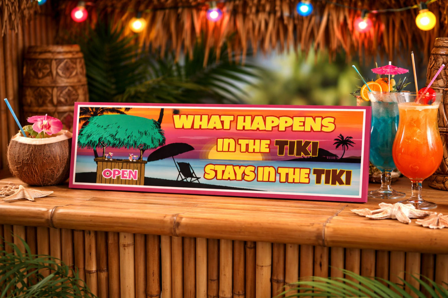 funny tiki bar sign reading what happens in the tiki stays in the tiki displayed on bamboo tiki bar countertop with tropical cocktails colorful lights and beach decor