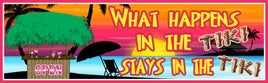 Colorful novelty tiki bar sign with sunset beach scene, palm trees, tiki hut, and bold text reading “What happens in the tiki stays in the tiki”