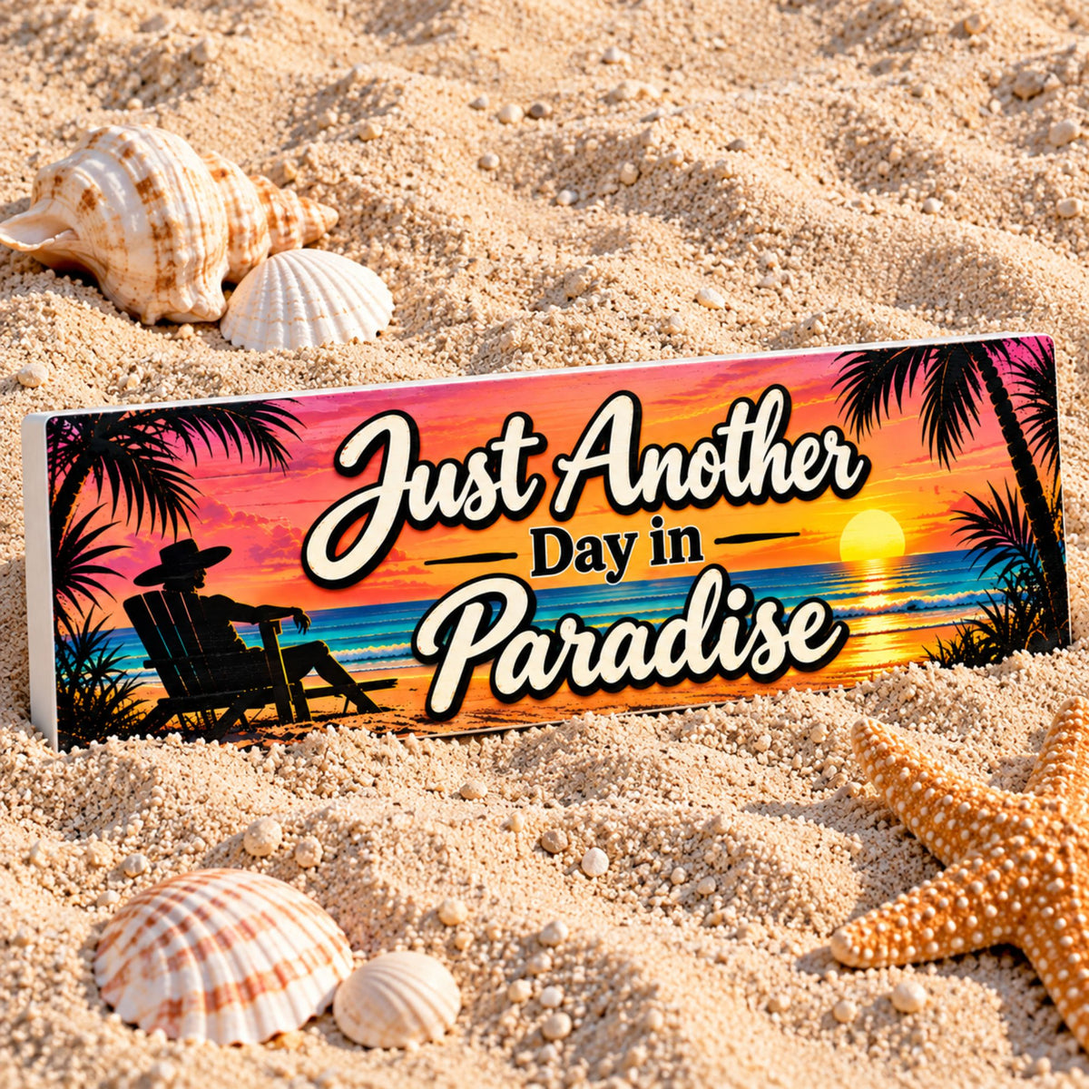 Just Another Day in Paradise rigid PVC sign displayed in beach sand with seashells