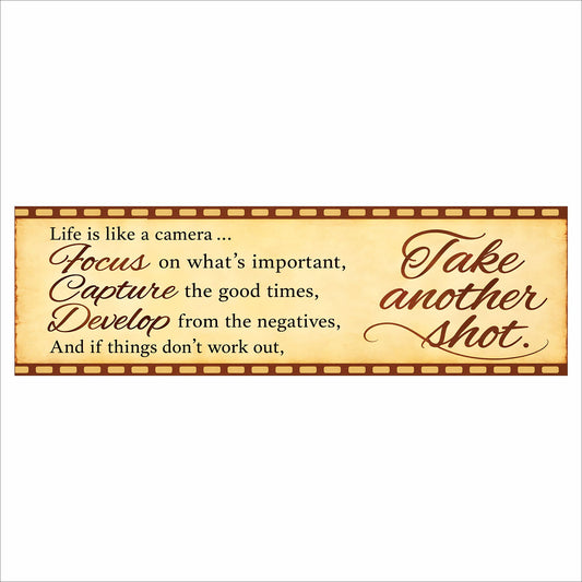 Life Is Like a Camera quote sign with a cream parchment-style background, brown lettering, and a vintage filmstrip border