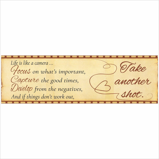 close up of inspirational life is like a camera sign on shelf with 16 inch width measurement shown above long narrow decor sign