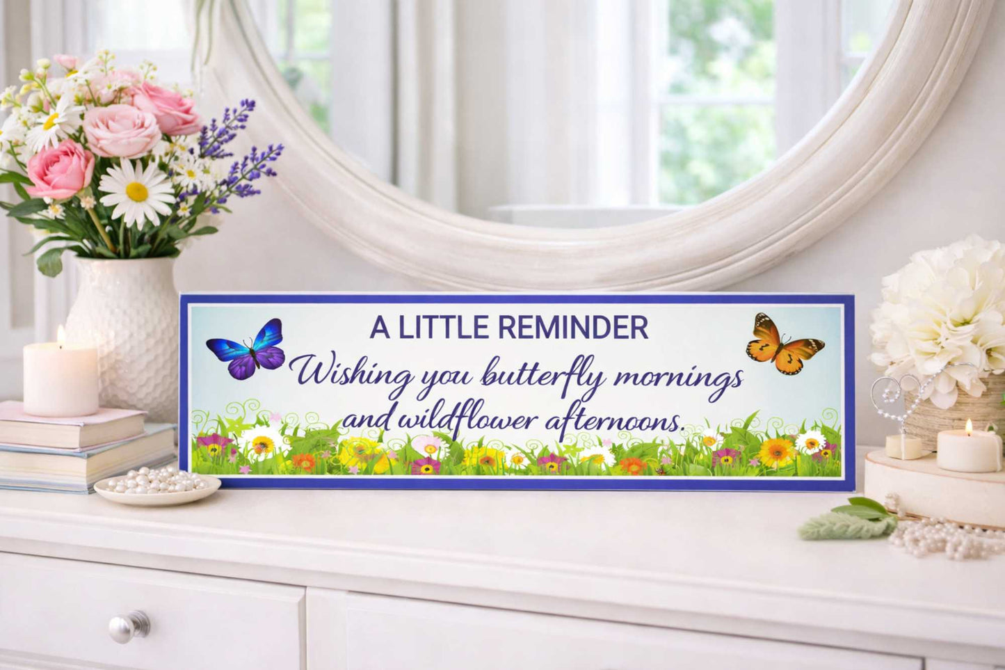 inspirational quote sign displayed on dresser with flowers and mirror background
