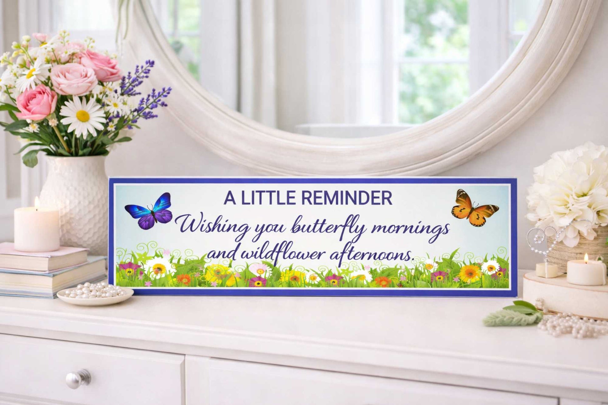 inspirational quote sign displayed on dresser with flowers and mirror background