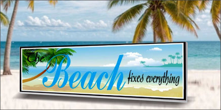 Coastal beach wall sign reading The Beach Fixes Everything displayed in seaside home décor