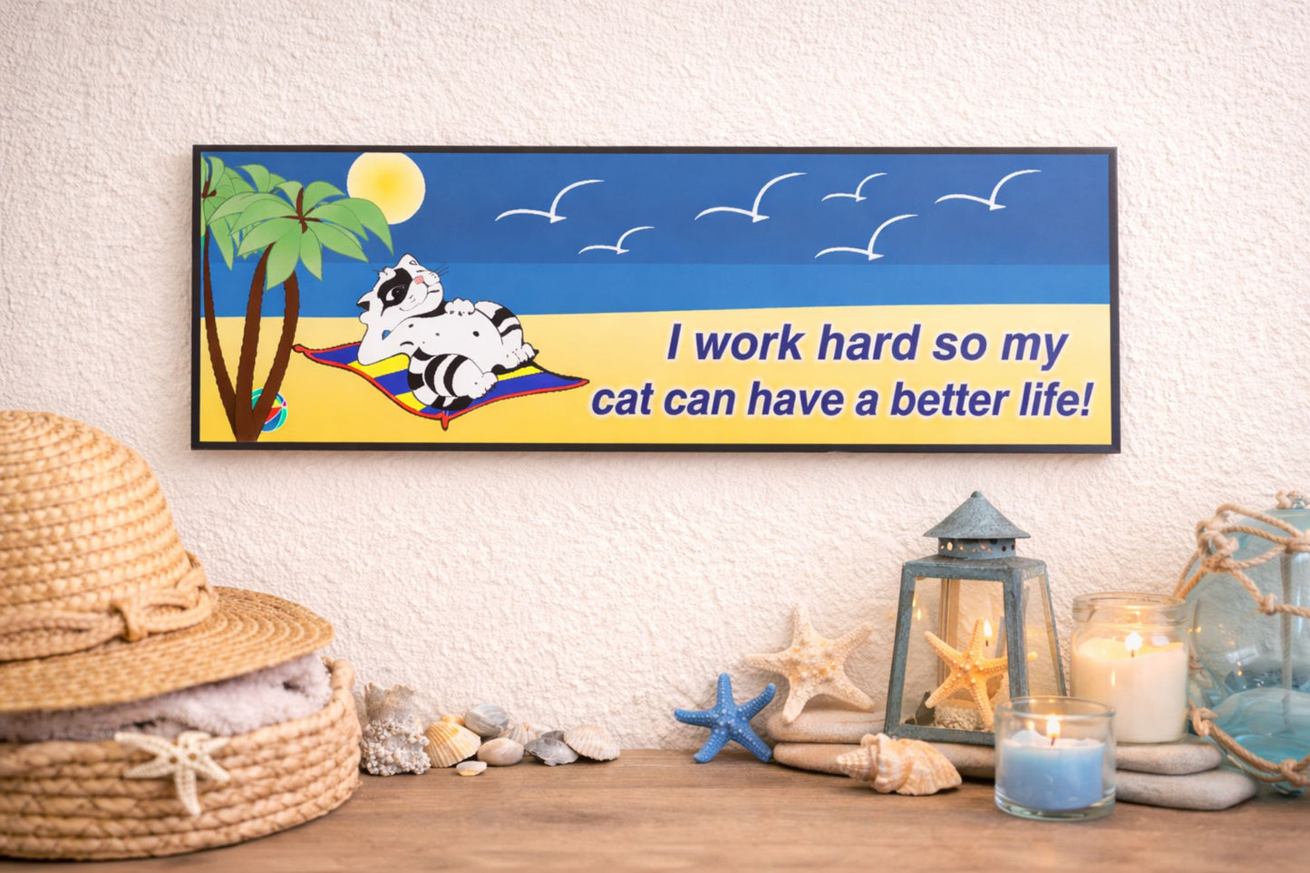 beach themed cat sign styled on shelf with coastal decor and candles