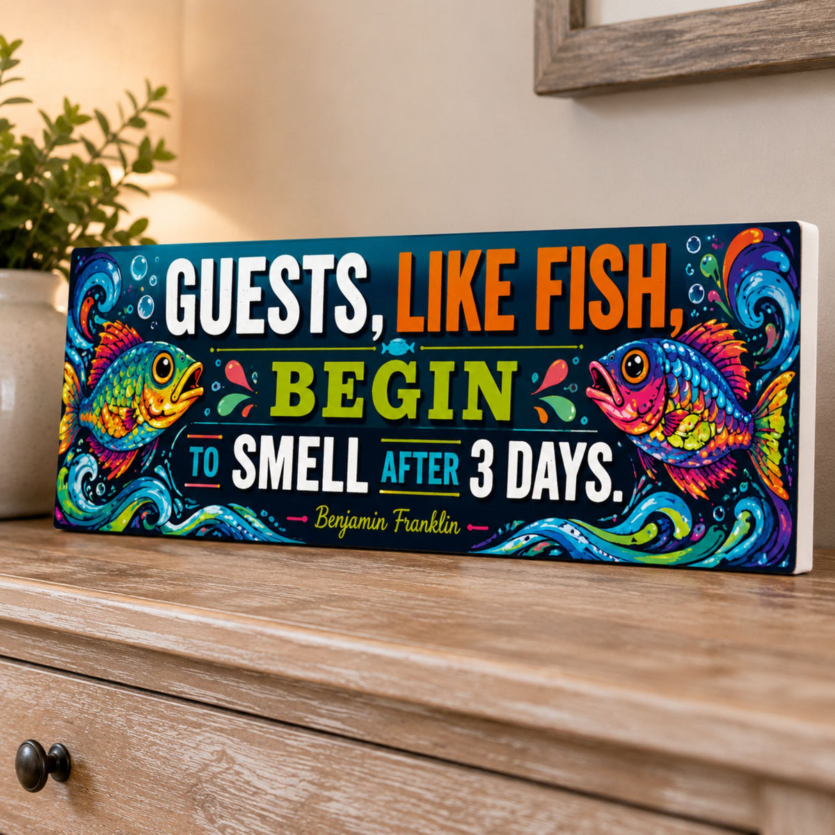 Funny fish quote sign displayed on a wooden dresser with a subtle white PVC edge, colorful fish, bold lettering, and blue waves.