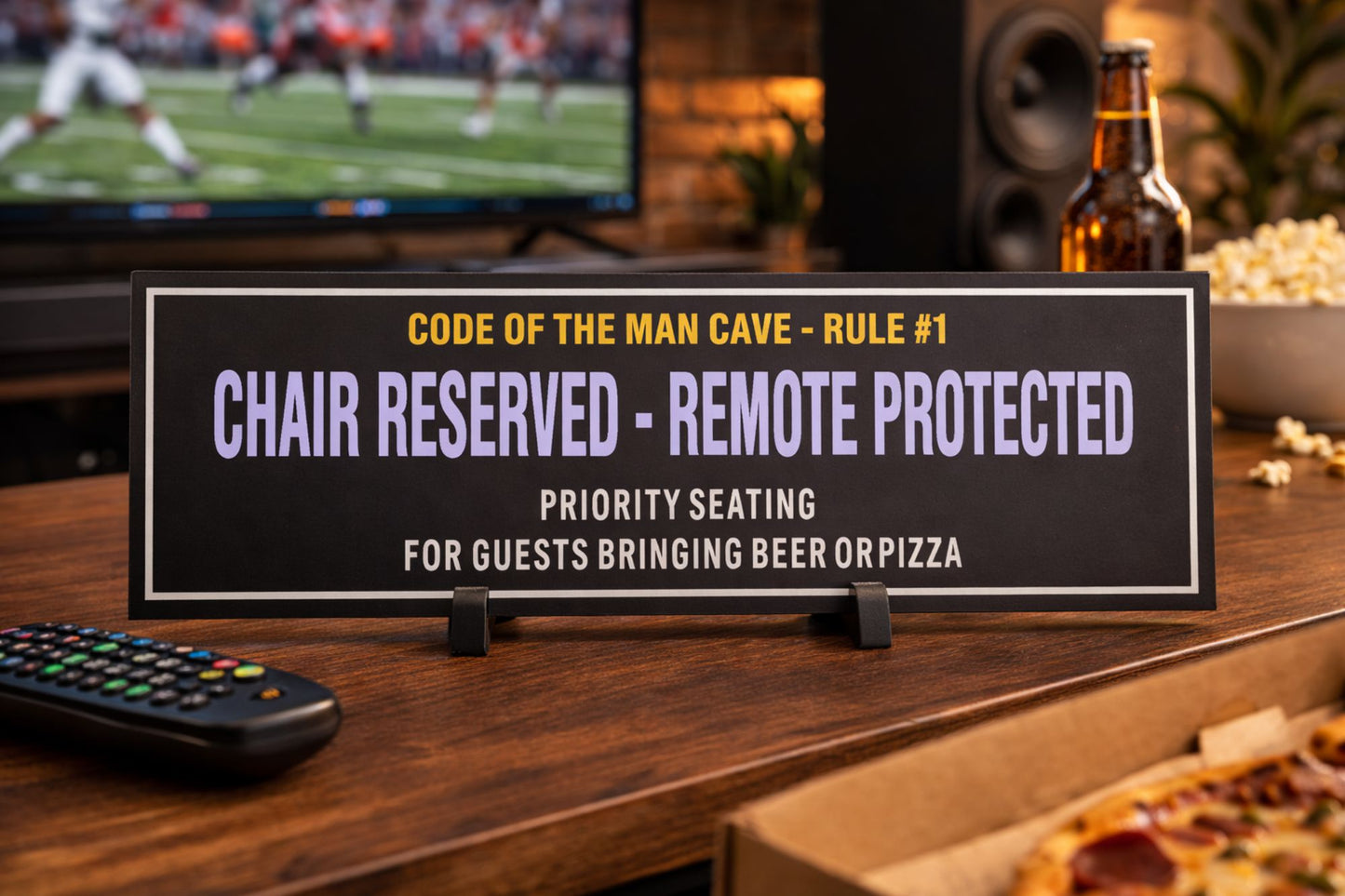man cave shelf sign displayed on media console with tv beer pizza and remote control lifestyle