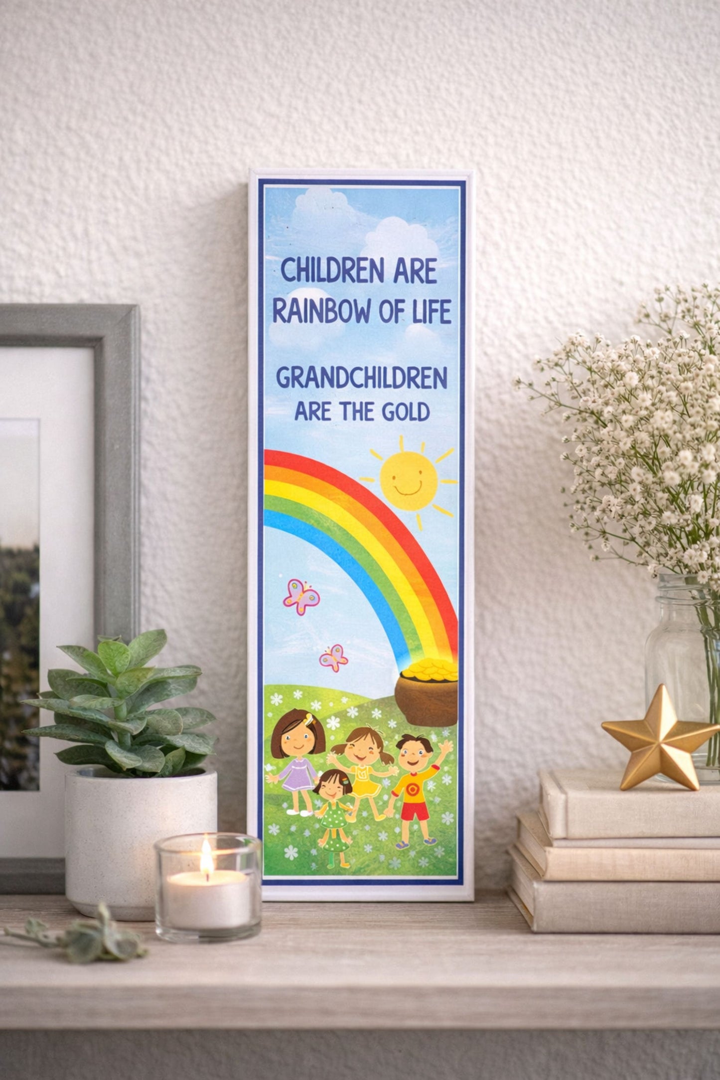 5x16 rainbow grandchildren sign styled on shelf with plant candle books and neutral home decor