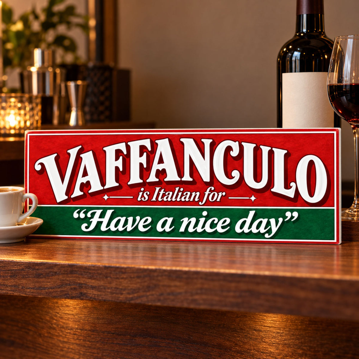 Red, white, and green Italian humor sign displayed on a wooden home bar beside an espresso cup, wine bottle, and wine glass.