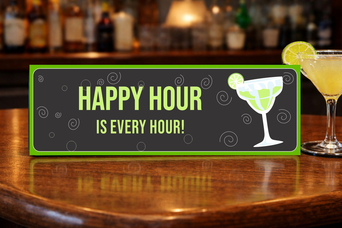 happy hour sign displayed on wooden bar top with margarita glass and cocktail tools bar decor sign