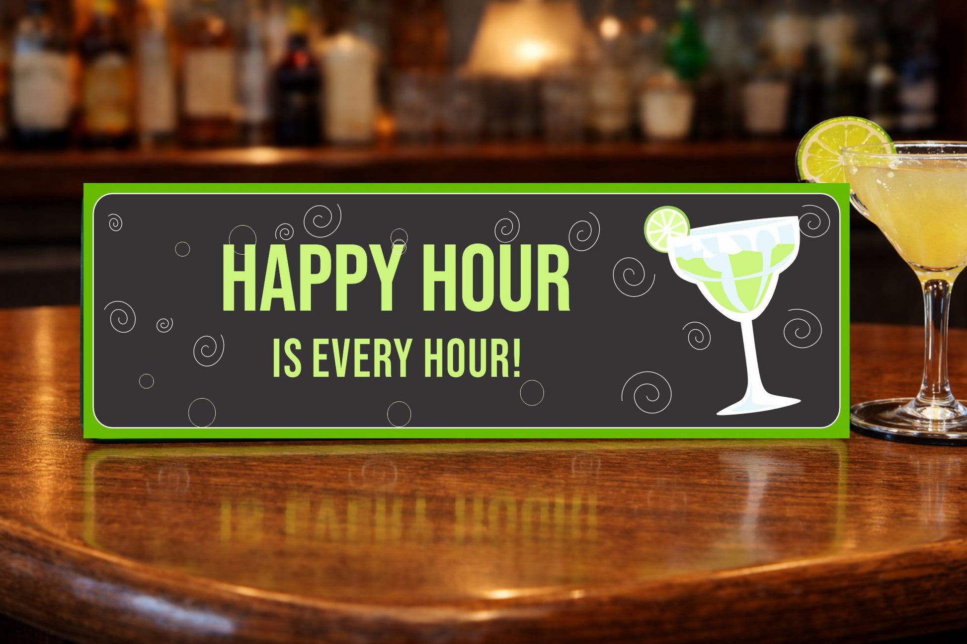 happy hour sign displayed on wooden bar top with margarita glass and cocktail tools bar decor sign