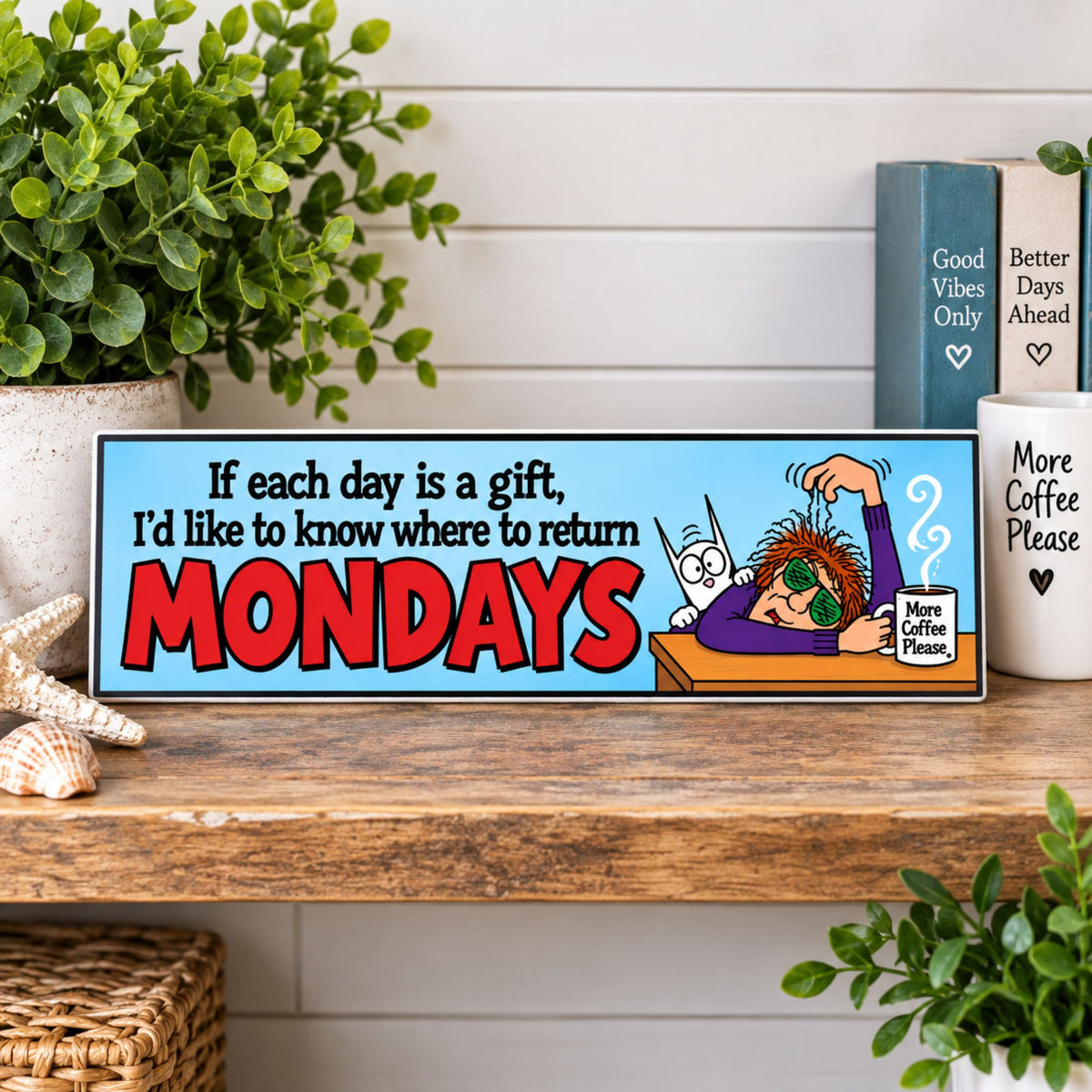 Funny Mondays sign displayed on a shelf with colorful cartoon artwork and coffee-themed humor.