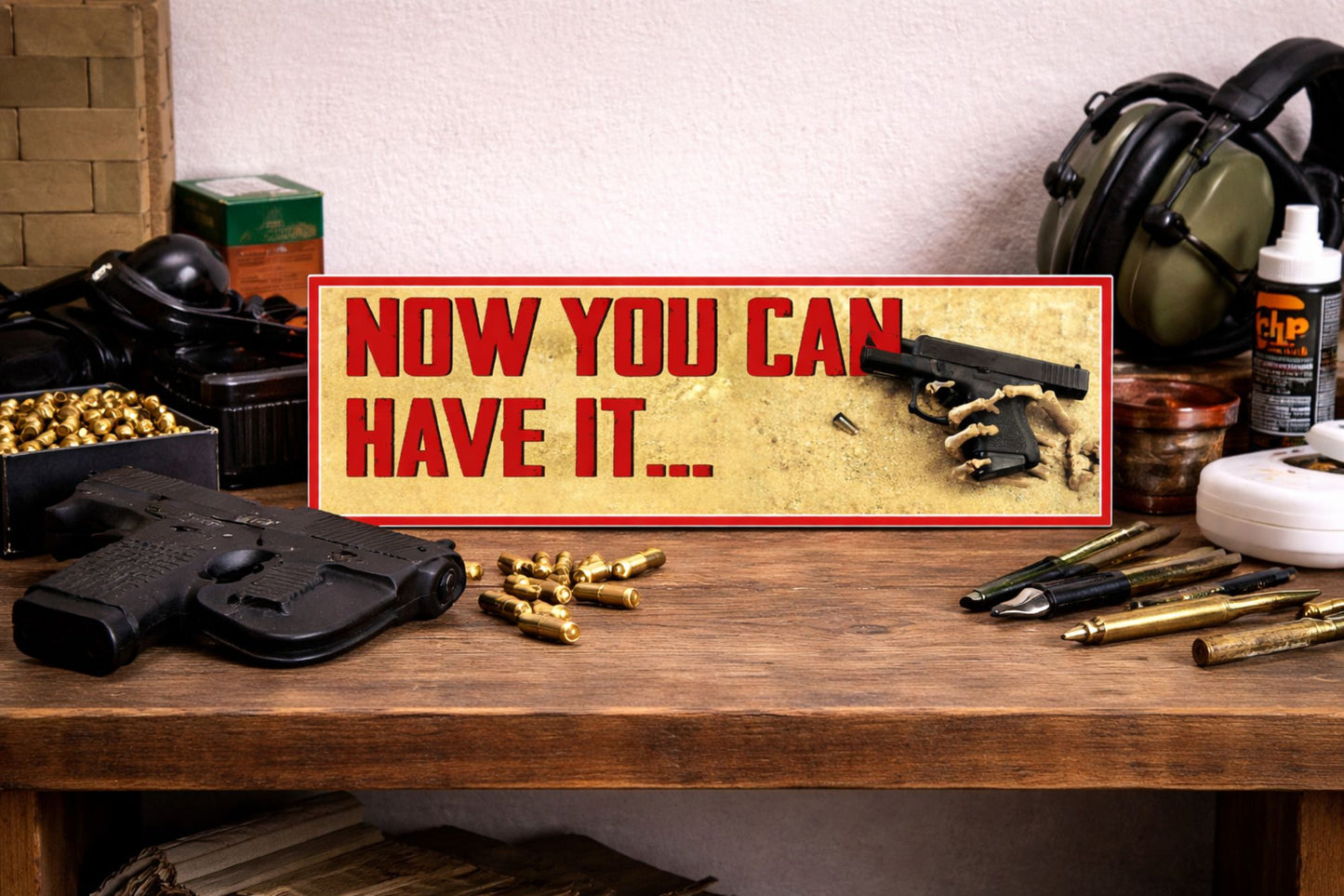gun humor sign on wooden workbench with handgun ammunition and range gear showing 16x5 tabletop display