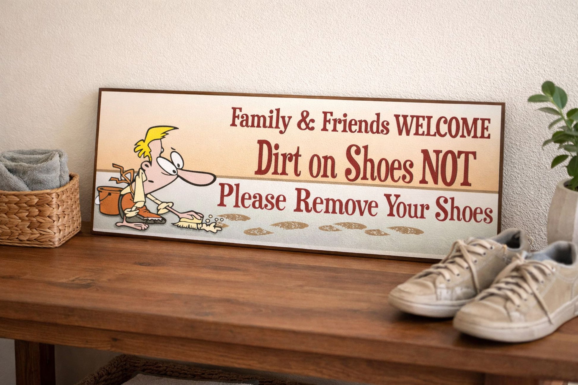 remove shoes sign displayed on entry table with sneakers beside it