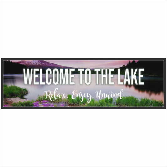 Close-up of welcome to the lake sign with mountain lake background and relax enjoy unwind message