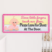Baby “Shoes Off” sign hanging on a nursery wall near crib and teddy bear, printed on vinyl laminated Komocel PVC