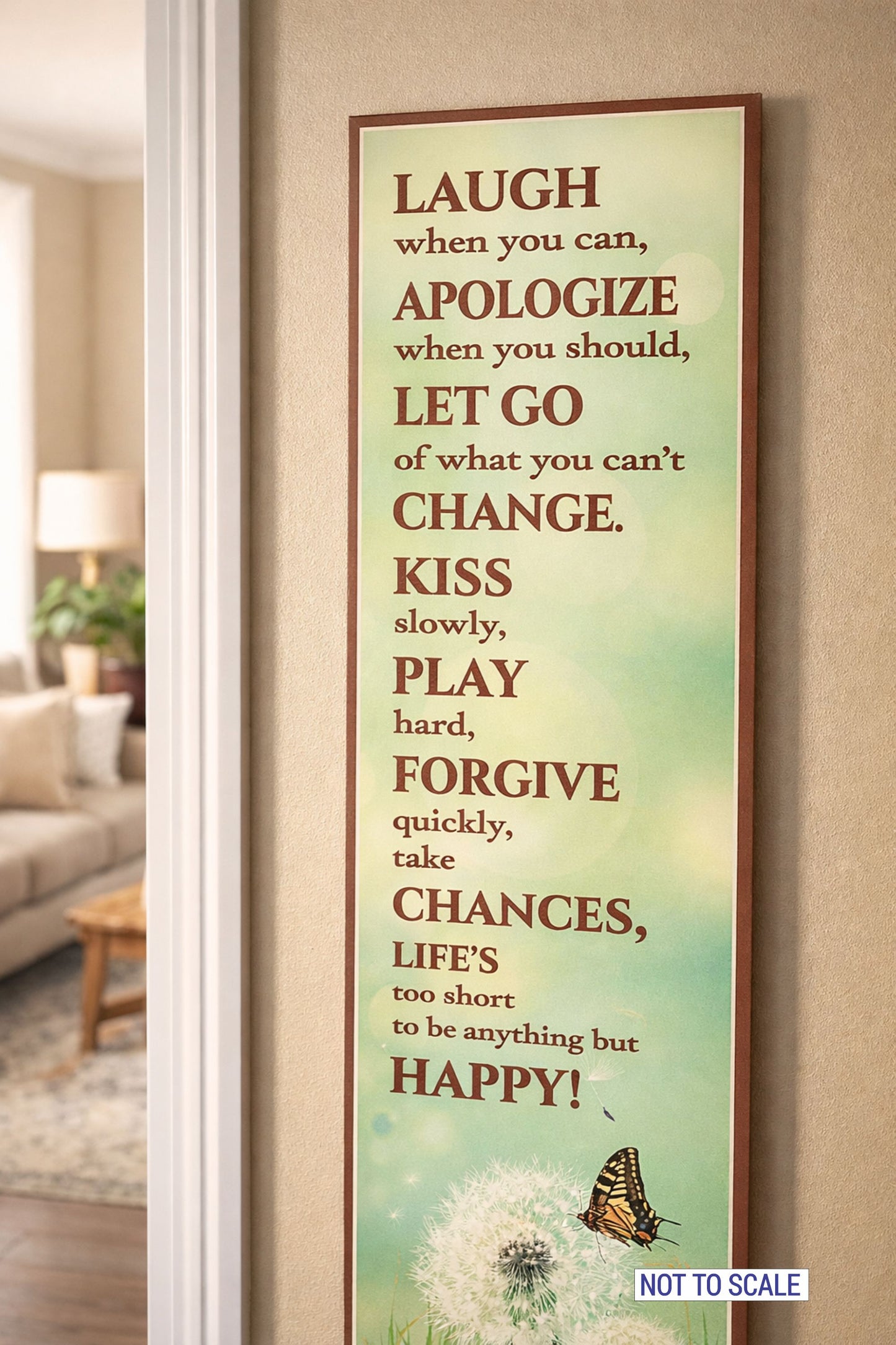 Vertical inspirational quote sign displayed on interior wall with neutral decor encouraging laughter forgiveness and happiness
