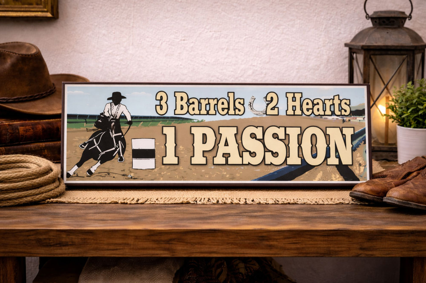 cowboy barrel racing sign on rustic table with hat rope boots and lantern western decor close up