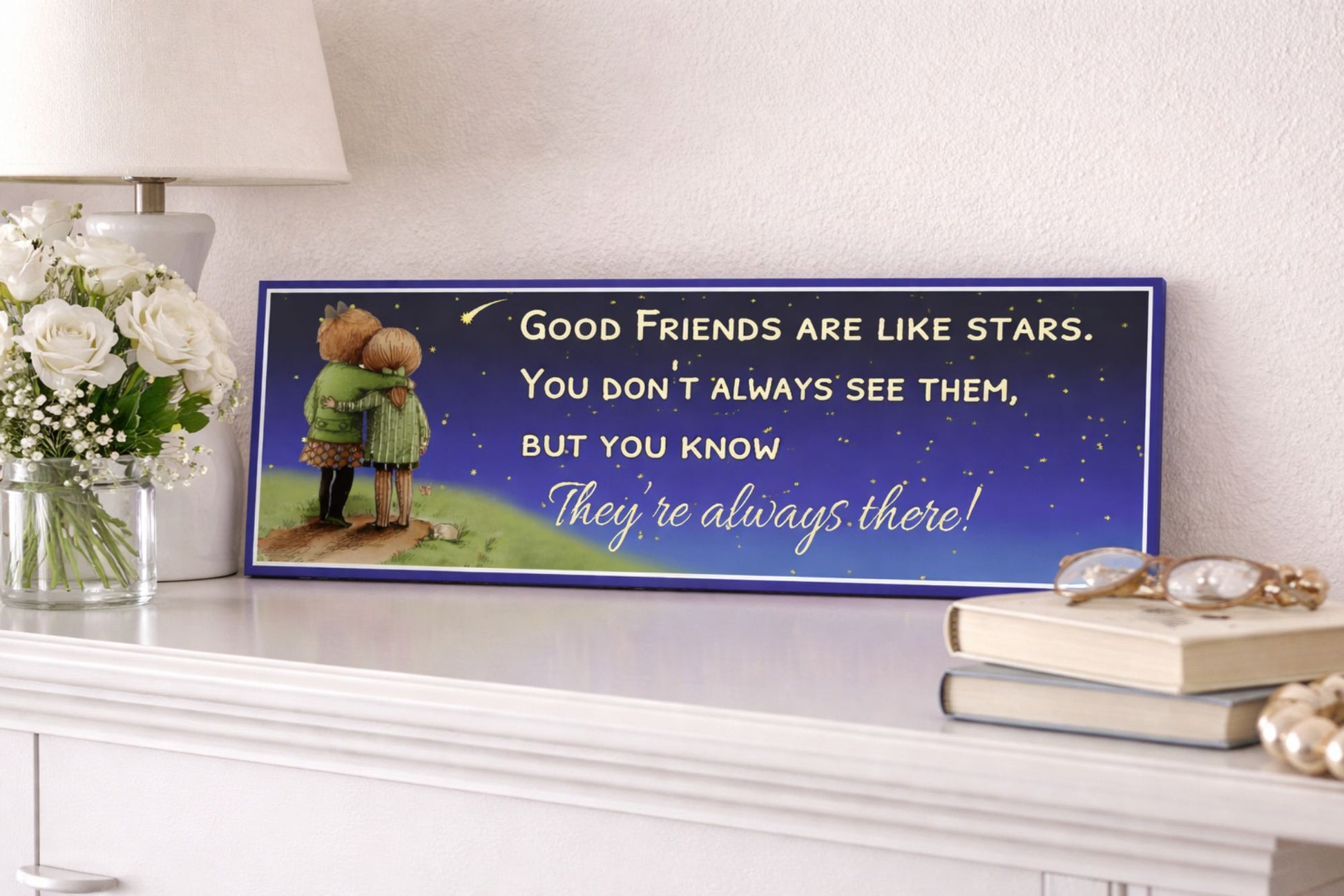 Friendship quote sign displayed on white mantel with flowers and books in soft neutral setting