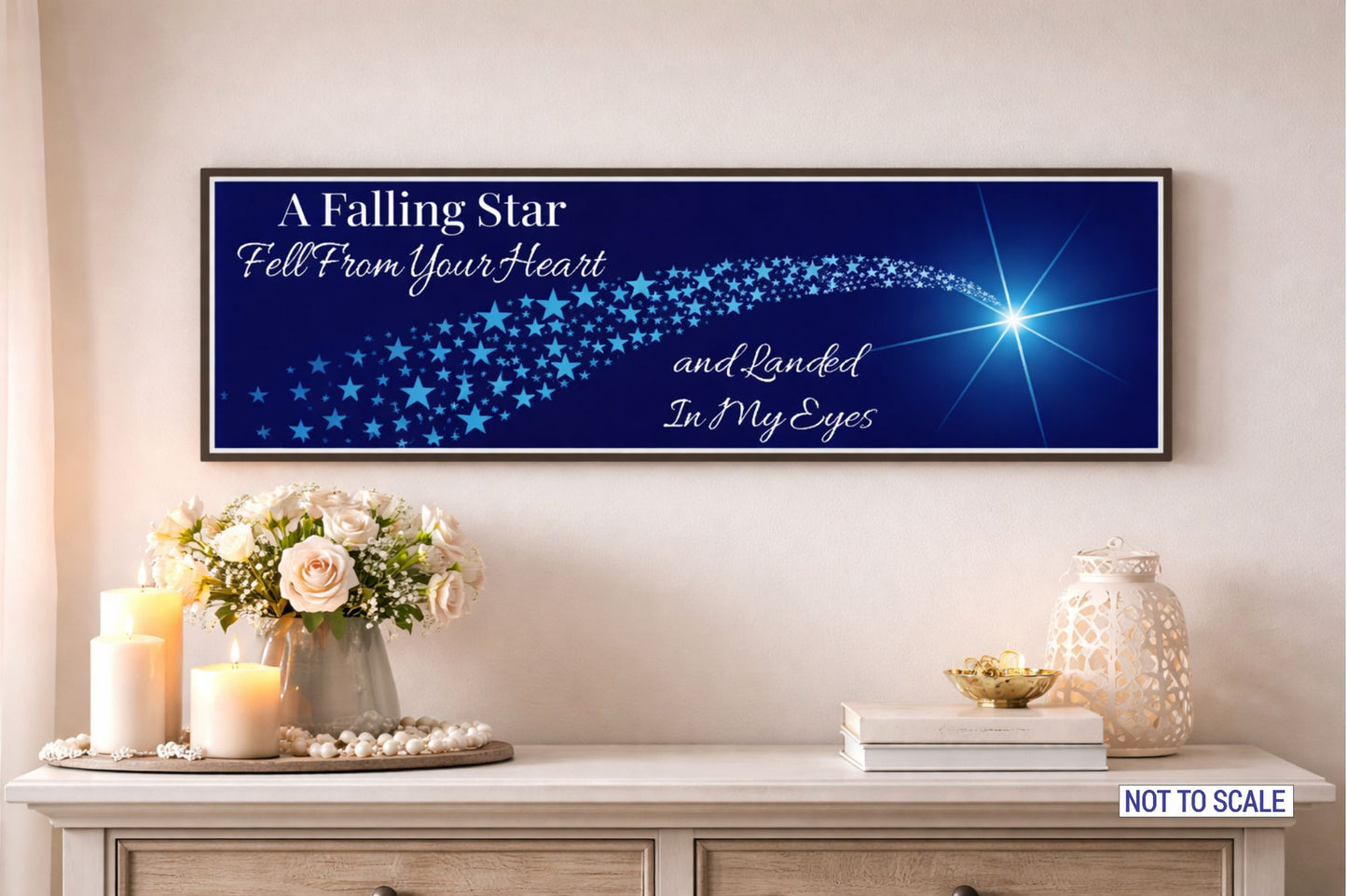 falling star love quote wall sign displayed above console table with candles and flowers