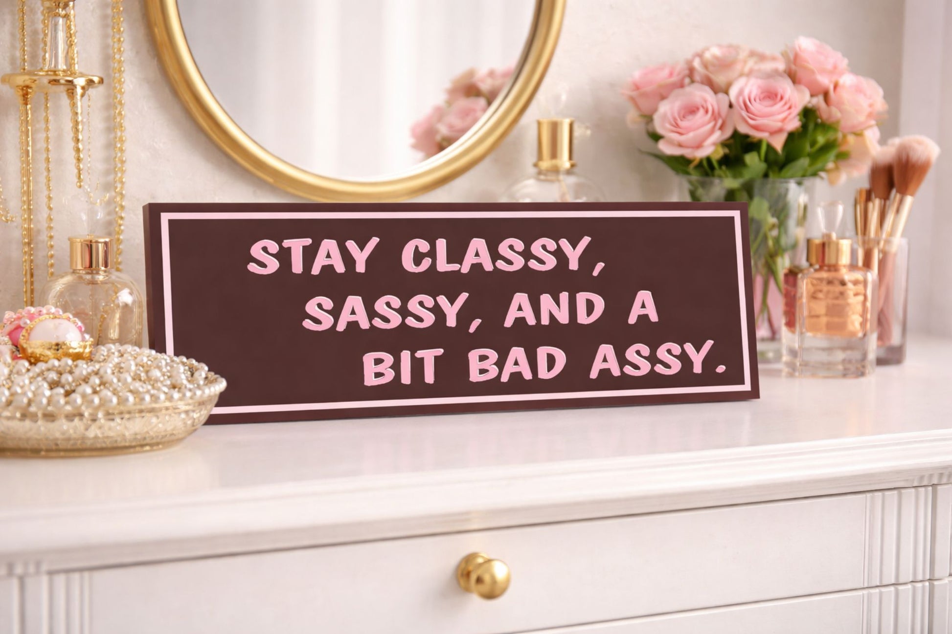 Stay Classy Sassy wall decor displayed on vanity dresser with mirror and flowers