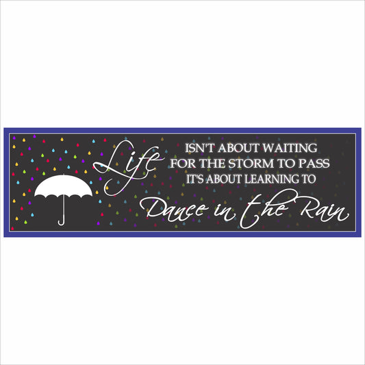 close up of motivational quote sign with colorful raindrops and umbrella design on long narrow sign