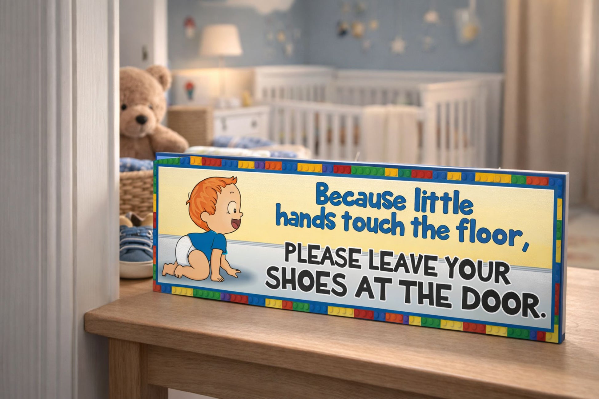 Nursery entry table with red hair baby shoes off sign near doorway