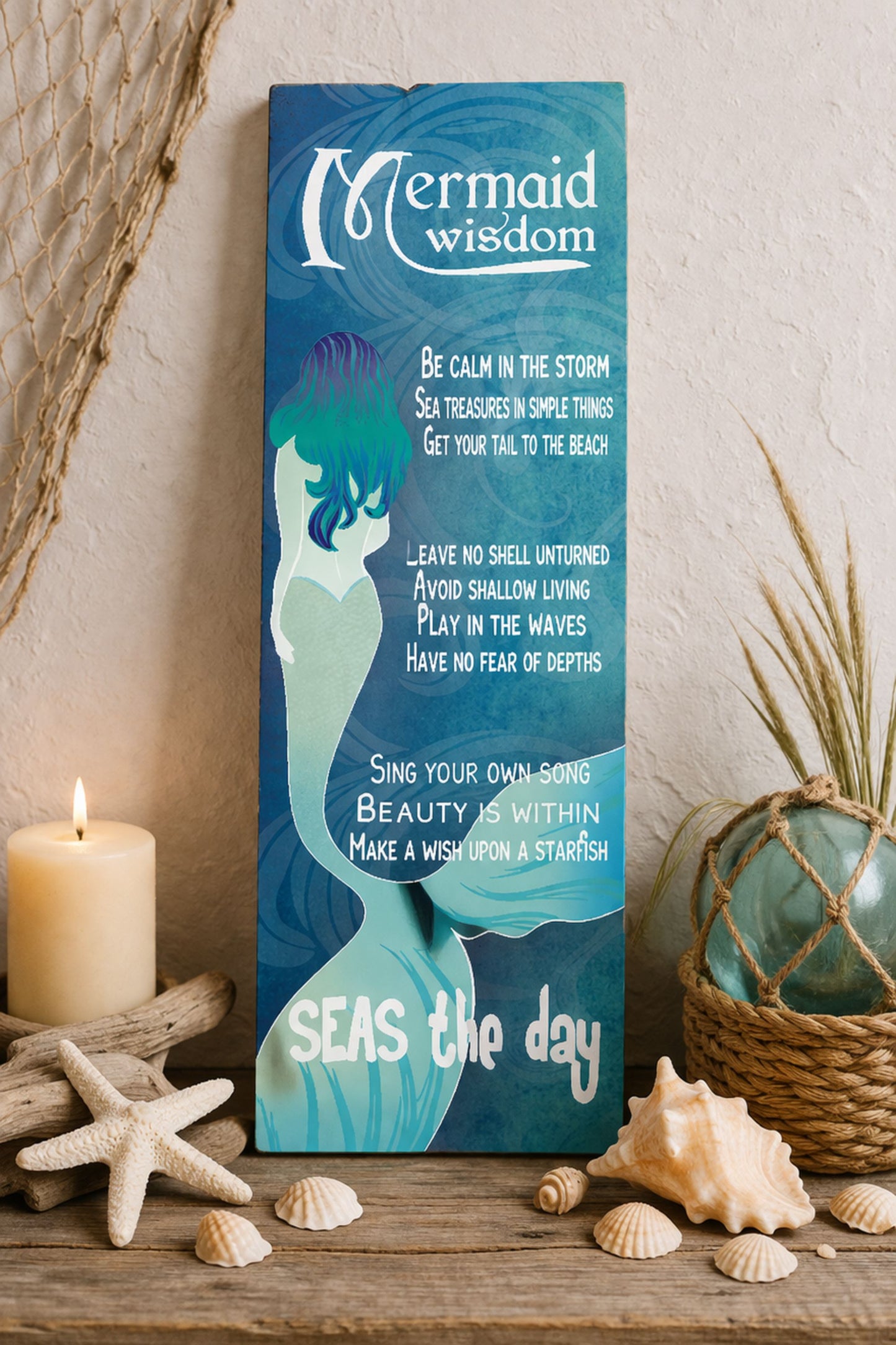 Mermaid Wisdom vertical beach wall decor displayed on coastal mantel with seashell accents