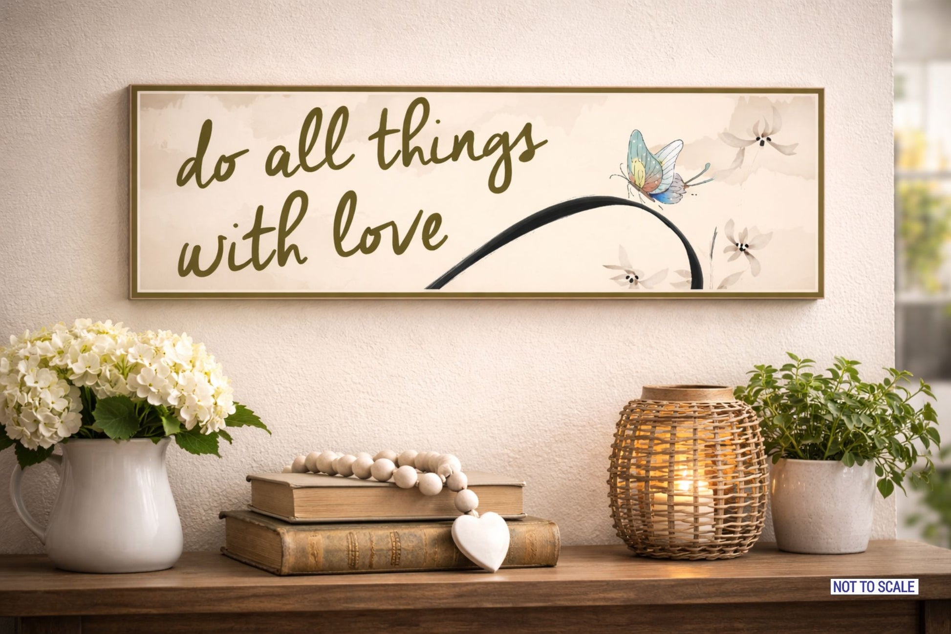 Inspirational butterfly wall sign displayed above console table with hydrangeas, lantern, and greenery