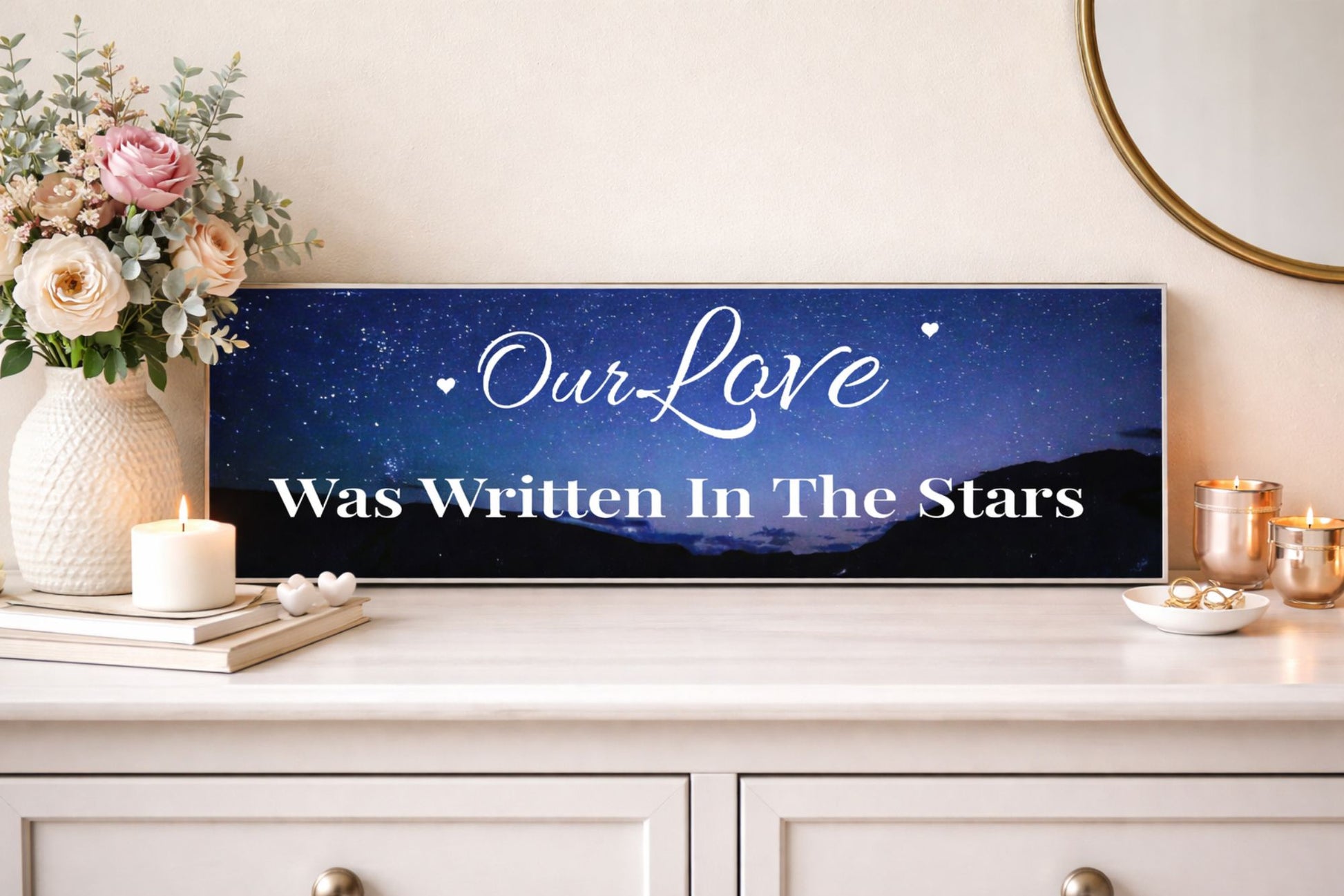 Lifestyle image showing romantic love quote sign on dresser with flowers and candles