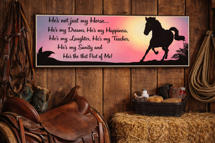 Equestrian wall sign mounted in rustic barn with saddle and tack decor