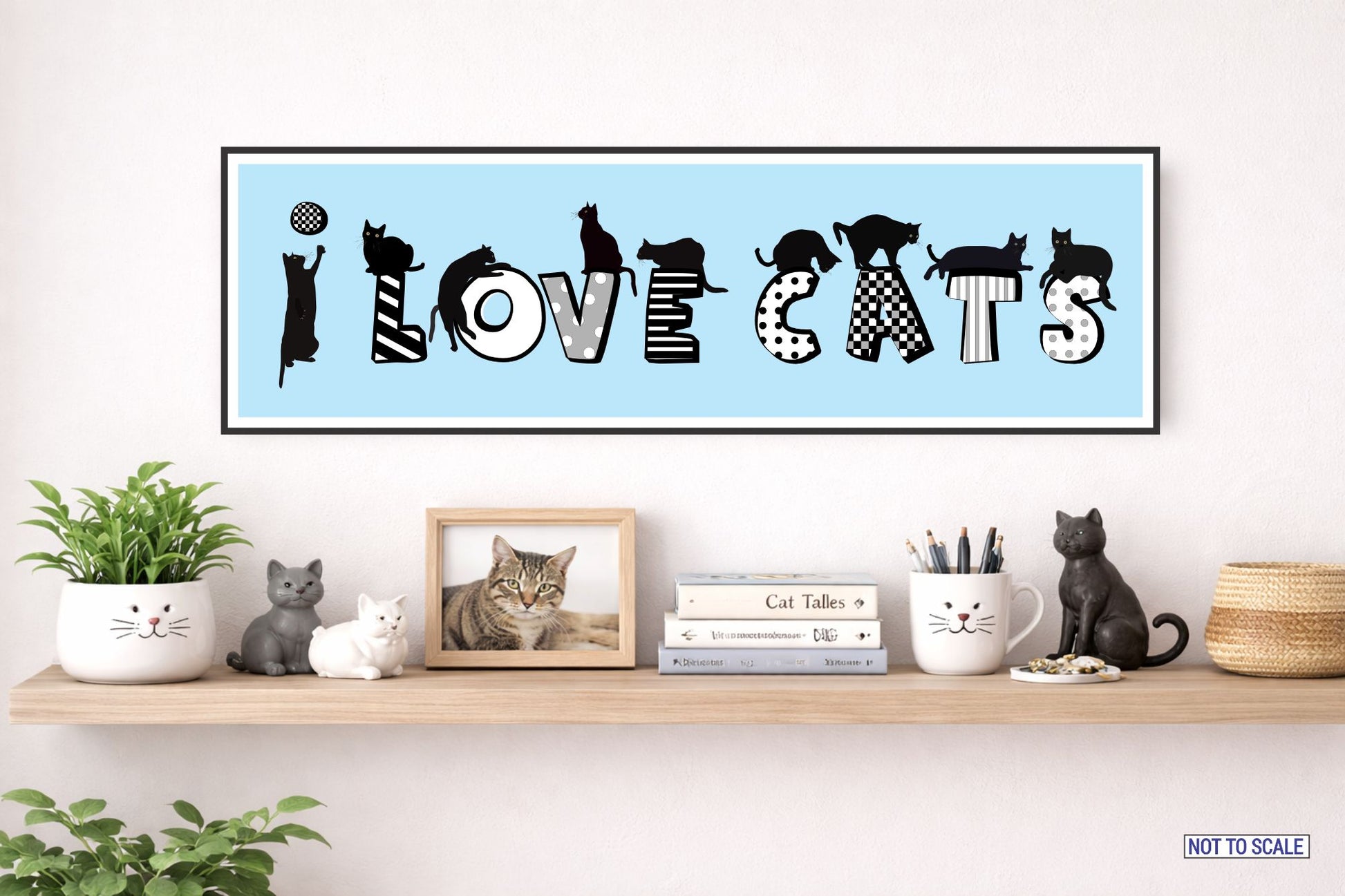 I Love Cats rectangular wall sign displayed above a styled shelf with cat figurines and framed cat photo not to scale