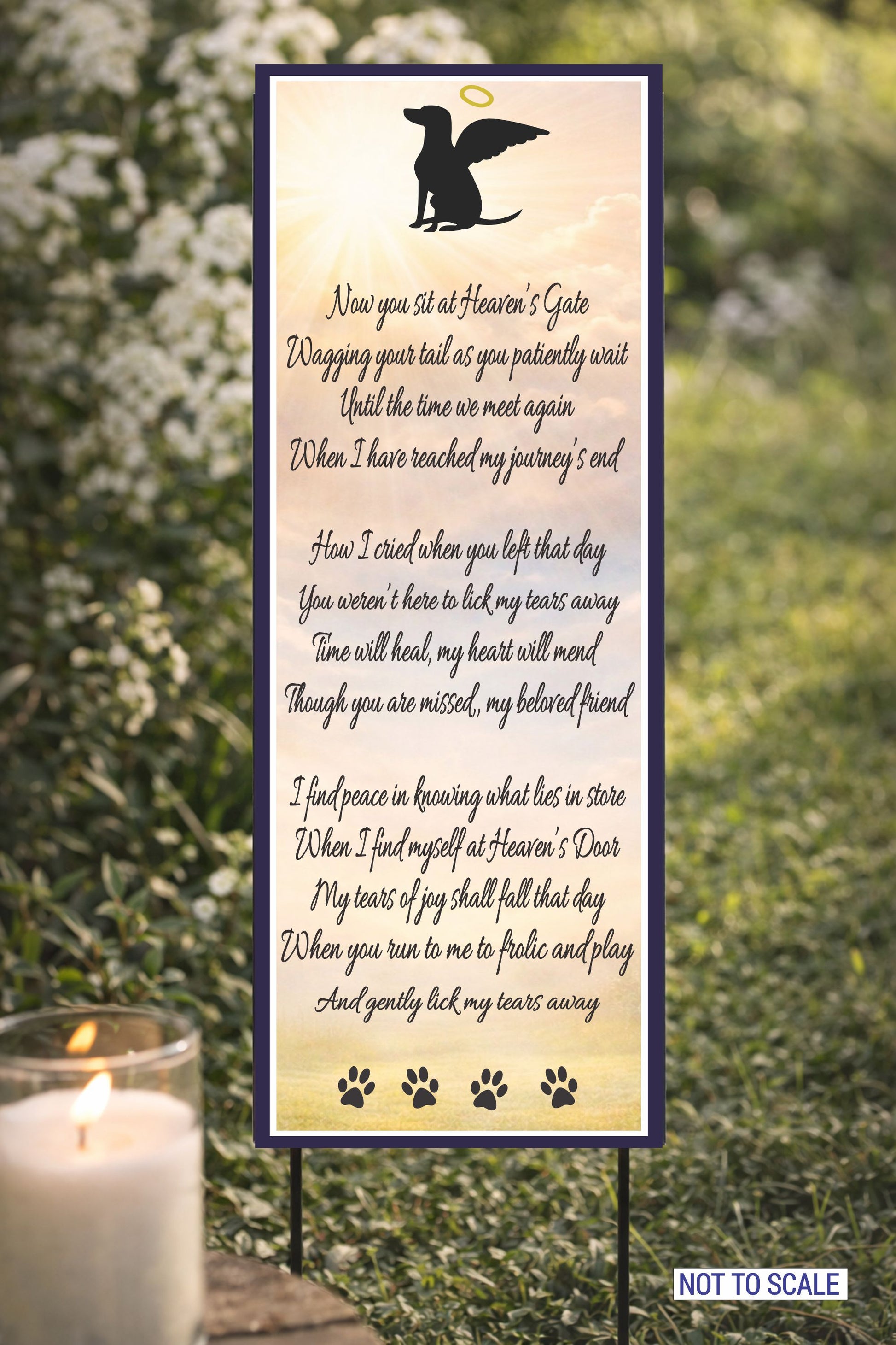 dog memorial poem sign displayed outdoors beside candle and flowers remembrance setting