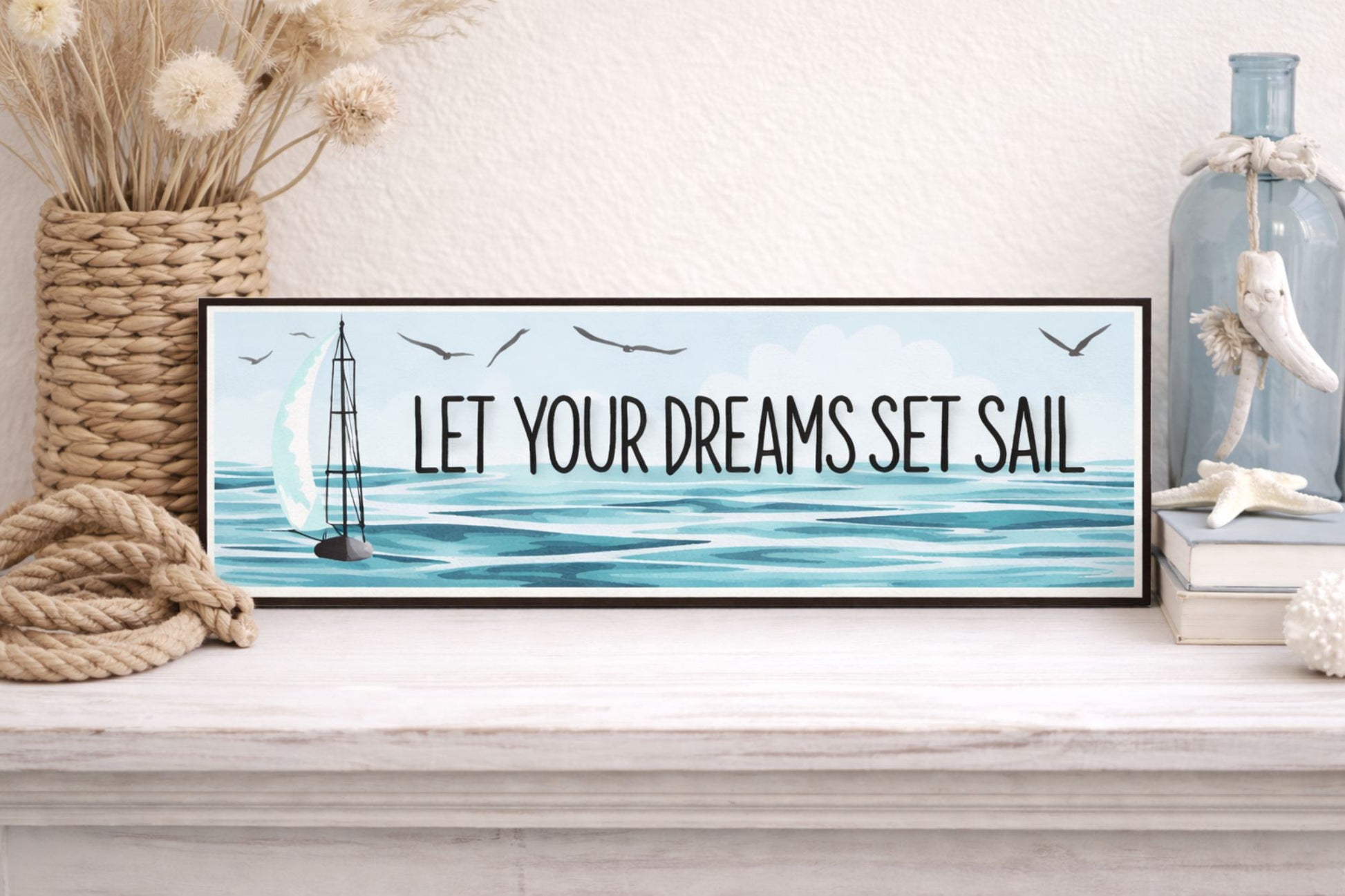 coastal shelf with sailboat sign rope decor and beach themed accents