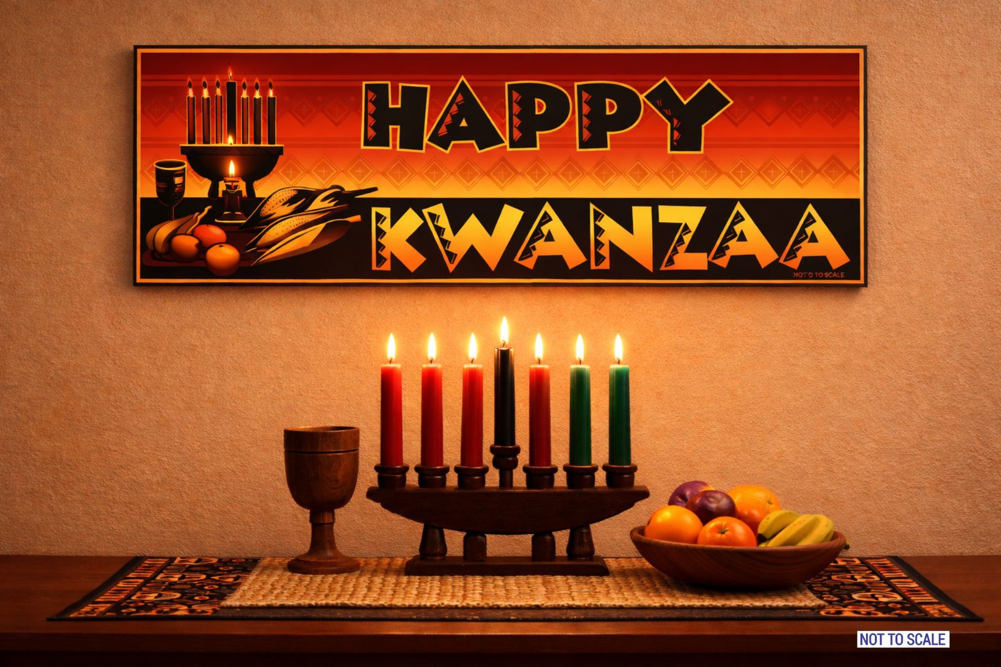 Happy Kwanzaa rectangular wall sign displayed above a table with lit kinara candles and fruit in a bright neutral holiday setting not to scale