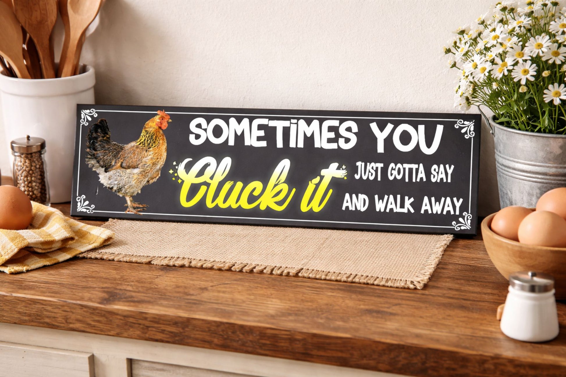 funny chicken sign cluck it farmhouse decor on kitchen counter with eggs and rustic accessories