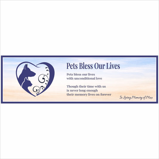 close up of personalized pet memorial sign with dog and cat heart silhouette and poem text on soft sky background